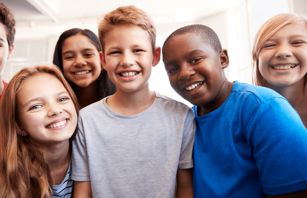 Grade School Kids Smiling At Camera